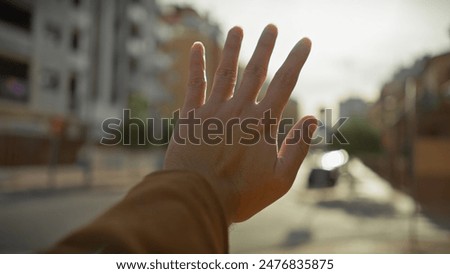 Similar – Image, Stock Photo open palm greeting sunlight. Hand in the air with soft light.