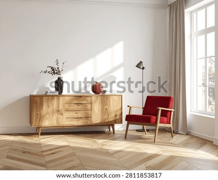 A sunlit room featuring a rustic wooden sideboard, a vibrant red armchair, and a tall window with sheer curtains.