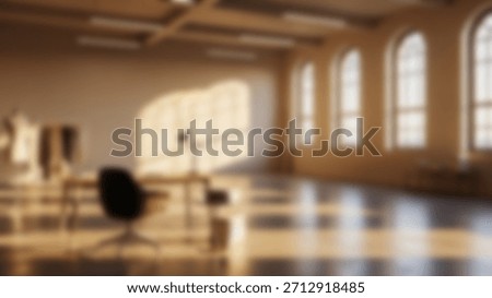Sunlit studio loft with large arched windows and workspace.