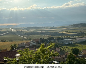 Sunlit village with scenic vineyards - Powered by Shutterstock