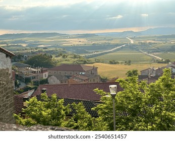 Sunlit village with scenic vineyards - Powered by Shutterstock