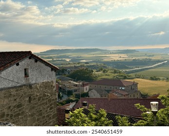 Sunlit village with scenic vineyards - Powered by Shutterstock