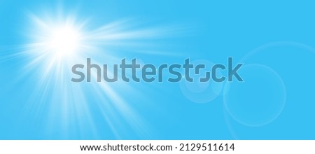 Sunny background, sun in summer on blue sky with lens flare.
The sun's rays and the lens light up in a bright blue sky.
Panorama format. Space for your own text.