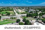 Sunny blue sky over intersection of Keller Parkway, Farm to Market Road 1709, Rufe Snow Drive, Keller, Texas, fast-growing mixed-use development area suburbs Dallas Forth Worth Metroplex, aerial. USA