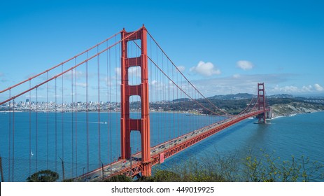 Sunny blue sky view of Golden Gate Bridge in San Francisco Bay