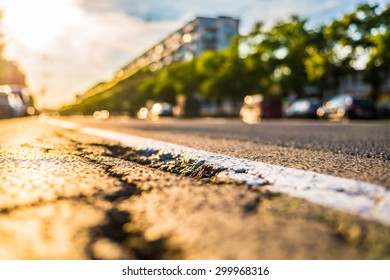 Sunny Day In A City, After The Earthquake Damaged The Asphalt, The View From The Ground Level