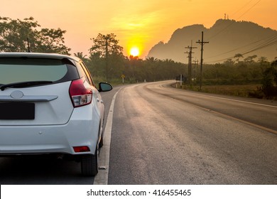 Sunny Day At A Country, The View On The Road Level From Behind The Car