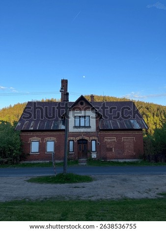 Sunny day at Medard Lake near Sokolov, Czech Republic, featuring clear water, forest views, and a modern lookout tower surrounded by nature and bike trails.