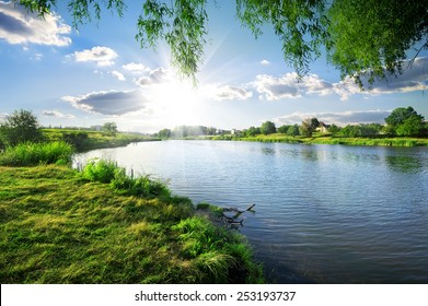 Sunny day on a calm river in summer - Shutterstock ID 253193737