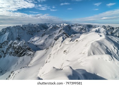 Sunny day on top of snowy mountains High Tatras in winter in Slovakia