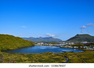 Sunny Day View Of Unalaska Island In Alaska