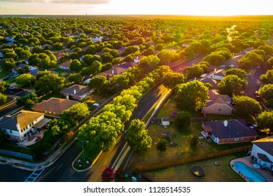 Sunny days ahead, Sunset real estate suburb homes. Community suburbia neighborhood in north Austin in suburb Round Rock , Texas Aerial drone view above new development