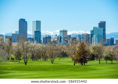 Sunny Denver Skyline. Spring in Colorado. Denver Skyline and Snowy Rocky Mountains. 
