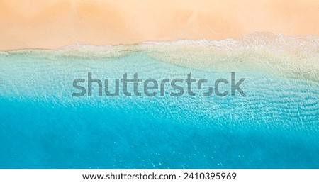 Sunny gold sandy beach, panorama. Panoramic view tranquil sandy beach. Peaceful sea waves shore. Ocean coast view. Aerial photography beachfront. Seaside exotic tropical Mediterranean nature landscape