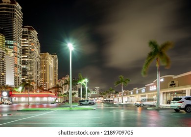 Sunny Isles Beach, FL, USA - August 1, 2022: Strip Mall Shopping Plaza Sunny Isles Beach Night Photo