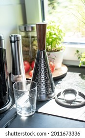 Sunny Kitchen Window With Various Kitchen Utensils And Vegetables On The Windowsill