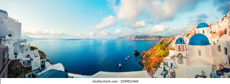 Sunny morning panorama of Santorini island. Colorful spring view offamous Greek resort Fira, Greece, Europe. Traveling concept background. Artistic style post processed photo.