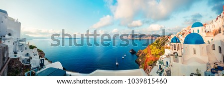 Sunny morning panorama of Santorini island. Colorful spring view offamous Greek resort Fira, Greece, Europe. Traveling concept background. Artistic style post processed photo.