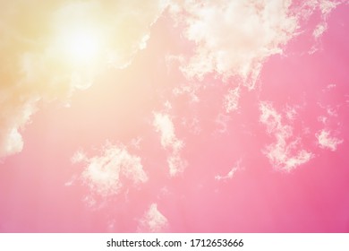 Sunny Orange Pink Sky Background. Beautiful Warm Sky With Clouds