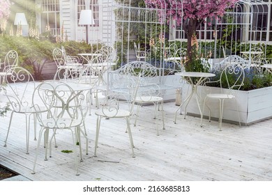 Sunny outdoor cafe with wrought iron furniture