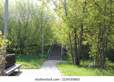 A Sunny Park Path Leading To The Stairs. Park In Spring