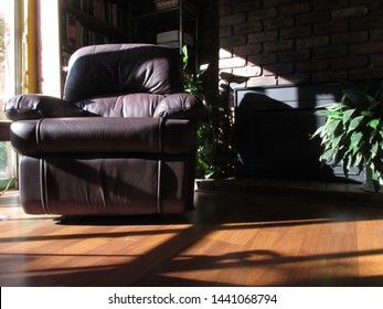 Sunny Reading Room With A Vintage Recliner Made Of Dark Colored Leather