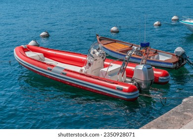 Sunny scenery including two boats at Lake Garda in Northern Italy