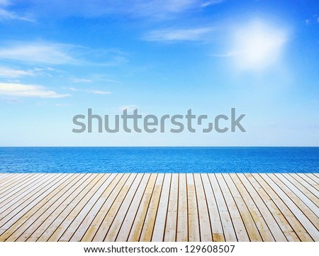Sunny sea and wooden walkway