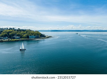 Sunny Shot of Alki Point West Seattle Washington Sailbot Ferry and Beach Vibrant Colored Water