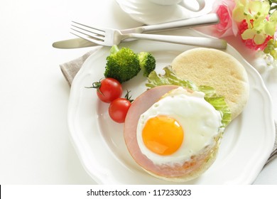 Sunny Side Up Egg And Ham On English Muffin For Healthy Gourmet Breakfast Image