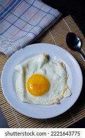 Sunny Side Up Eggs On A White Plate. As A High Protein Breakfast Menu