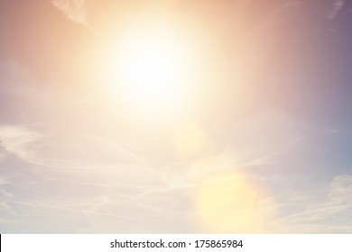 Sunny sky background in vintage retro style with sun flare - Shutterstock ID 175865984