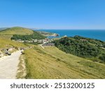 Sunny sky, hill in jurassic coast with sea view, lulworth cove , trekking to durdle door in south uk