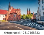 Sunny summer cityscape of Wloclawek town, Poland, Europe. Attractive morning view of Church of Saint Vitalis. Traveling concept background.