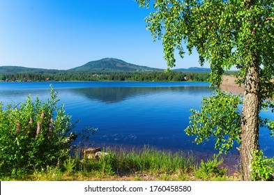 A sunny summer morning around lake siljan, nestled between forests and rolling hills in beautiful Dalarna,Sweden. - Shutterstock ID 1760458580