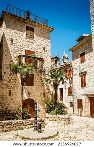 Sunny summer view of the cozy street in Kotor old town, Boka Kotor bay, Montenegro