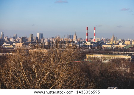 Sunny super-wide angle view from Sparrow Hills (Vorobyovy Gory), Moscow, Russia, with Luzhniki Stadium, Moscow cable car ropeway gondola, and scenery panorama beyond the city