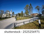 Sunny view of the Church of the Life-Giving Spring, Cathedral Square, and Lenin Garden in Arzamas, showcasing historical architecture and lush greenery