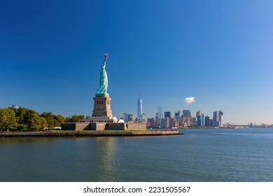 Sunny view of the Statue of Liberty National Monument at  New York City