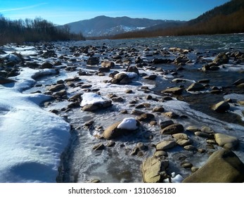 Sunny Winter Day At River, Ice And Snow On The River Bank