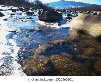 Sunny Winter Day At River, Ice And Snow On The River Bank