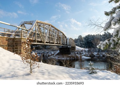 sunny winter landscape with iron construction bridge, Valmiera, Latvia - Shutterstock ID 2235933693