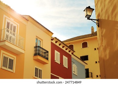sunny yellow houses - Shutterstock ID 247714849