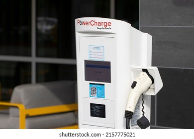 Sunnyvale, CA, USA - Apr 28, 2022: A PowerCharge electric vehicle charging station is seen in a parking lot outside a hotel in Sunnyvale, California. The EV charger is managed by EV Connect.