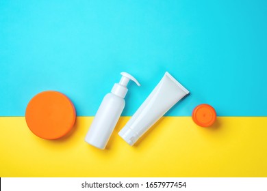 Sunprotection objects, suscreen. Flat lay, natural cosmetics, cream SPF for face and body. Summer Travel Vacation Concept