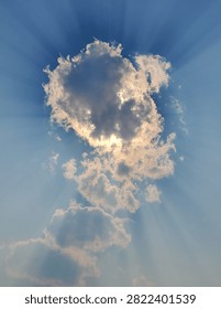 Sunrays bursting through a cloud