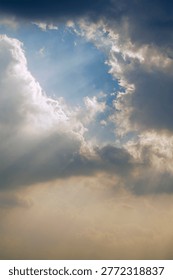 sunrays passing in between through cloud,The sun and clouds in the daytime.