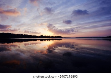sunrice at the lake with reflection