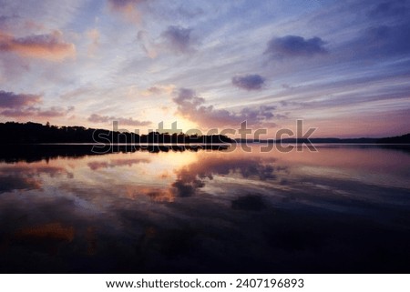 sunrice at the lake with reflection