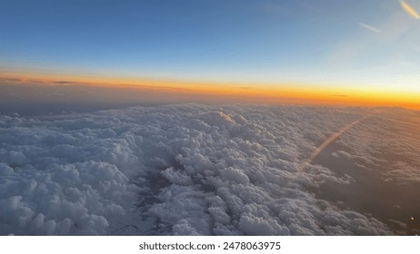 sunrise above the clouds cockpit view - Powered by Shutterstock